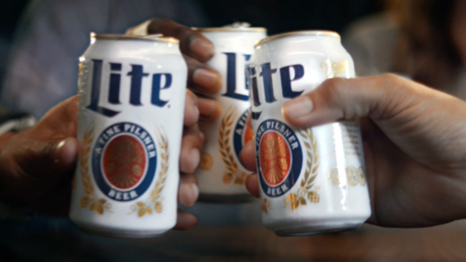 Miller Lite hands holding cans